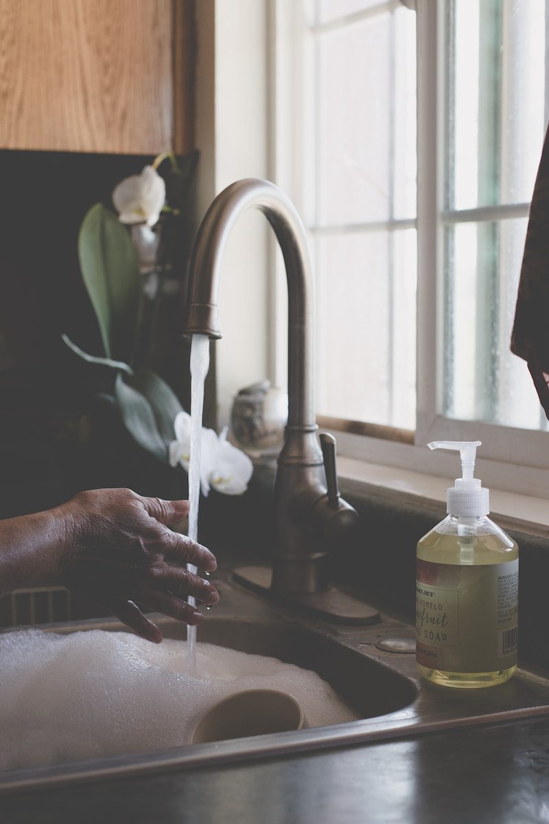 Photo by Sixteen Miles Out person holding white plastic pump bottle